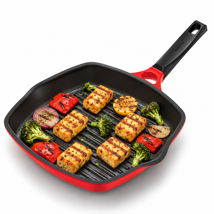 A Hawkins grill pan die cast 30cm with a black handle, shown filled with grilled tofu, broccoli, red peppers, and onion on a white background.
