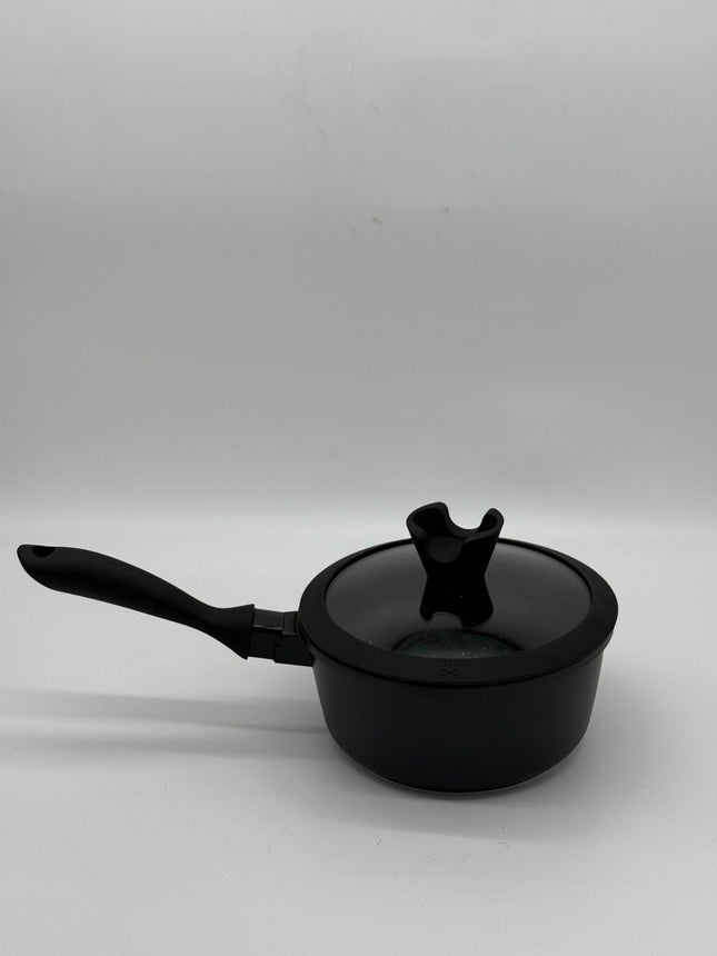 Side angle view of Chef and Cook non stick milk pan with glass lid