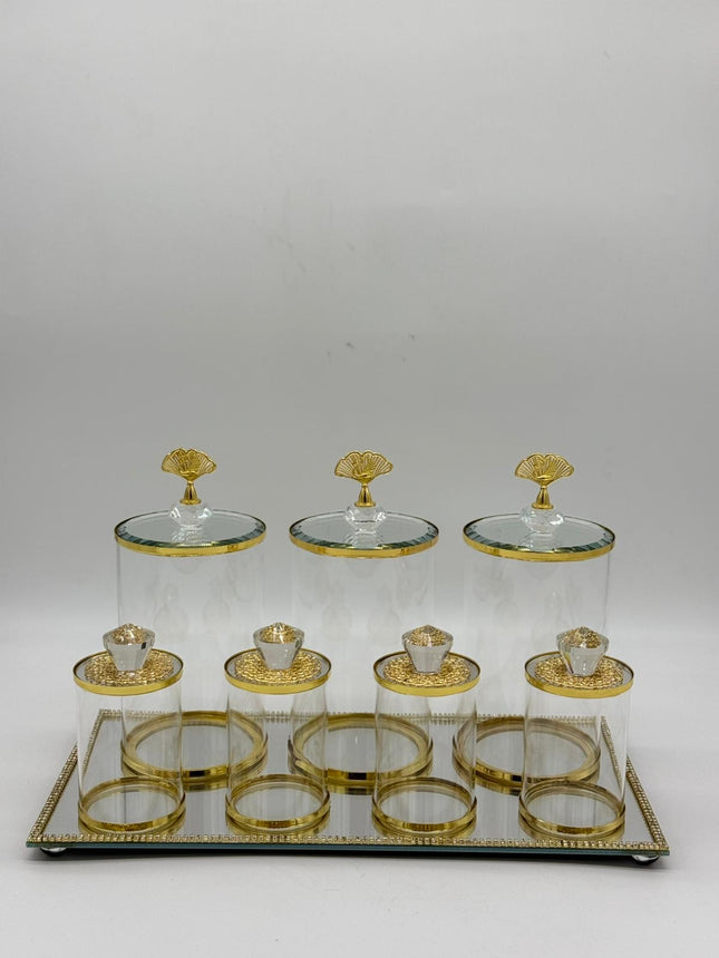 Luxury 7 piece gold glass kitchen canister set with decorative tray on white background