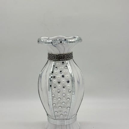 Decorative vase with mirror-like surface and black decorative band on a gray background