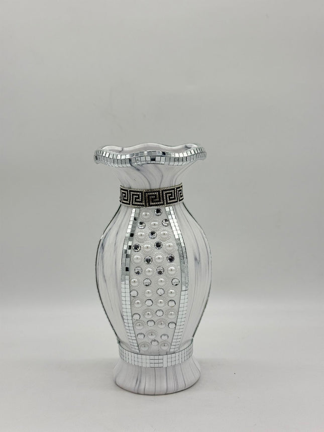 Decorative vase with mirror-like surface and black decorative band on a gray background